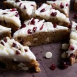 Cranberry bliss bars layed out on a sheet tray.