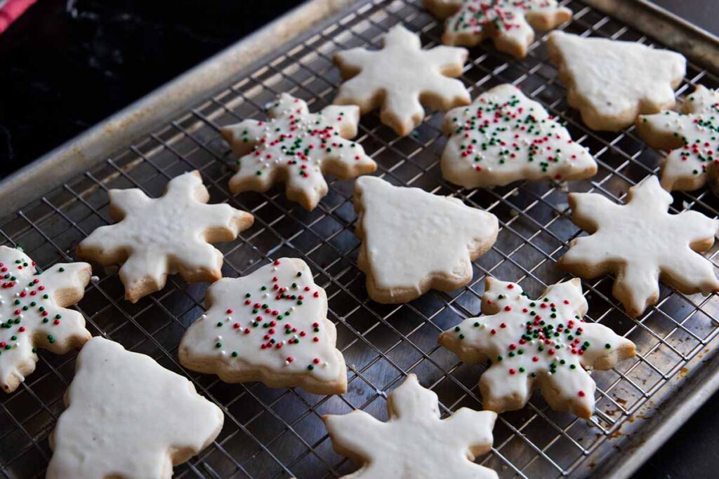 eggnog cookies on a wire rack in a baking pan