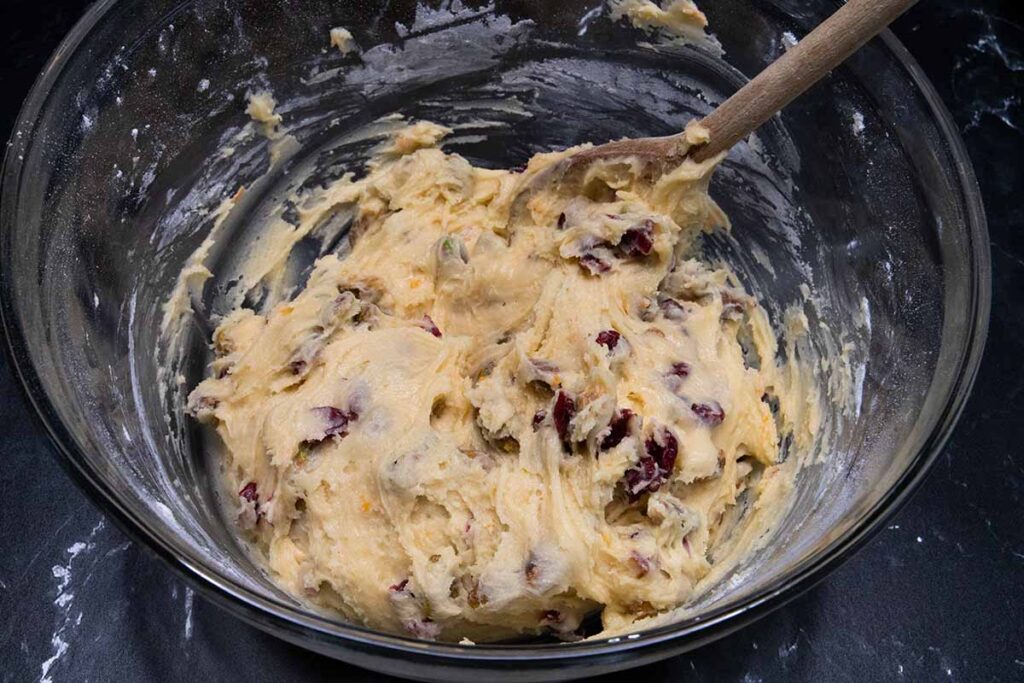 Dough in a glass mixing bowl.