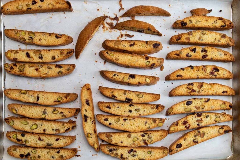 Baked cranberry pistachio biscotti on baking sheet.