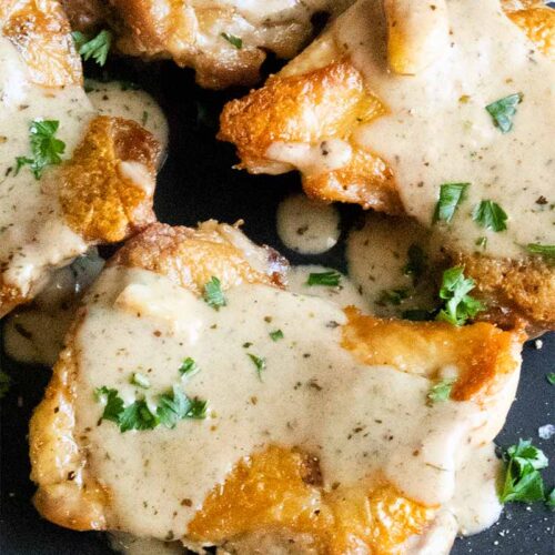 Crispy chicken thigh with a garlic cream sauce