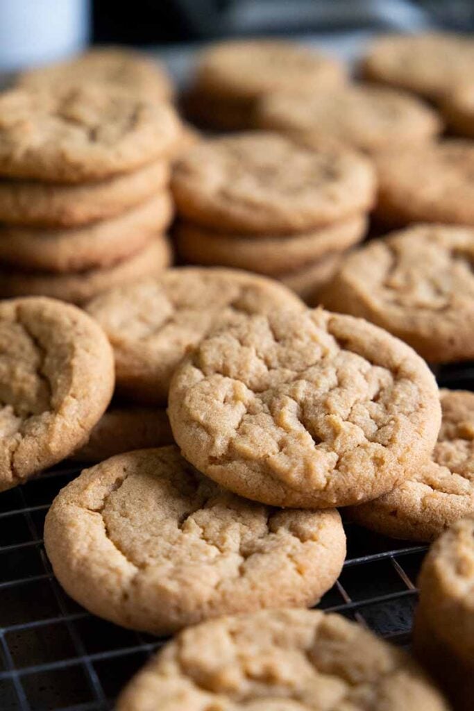 Crunchy peanut butter cookies stacked on top of each other.