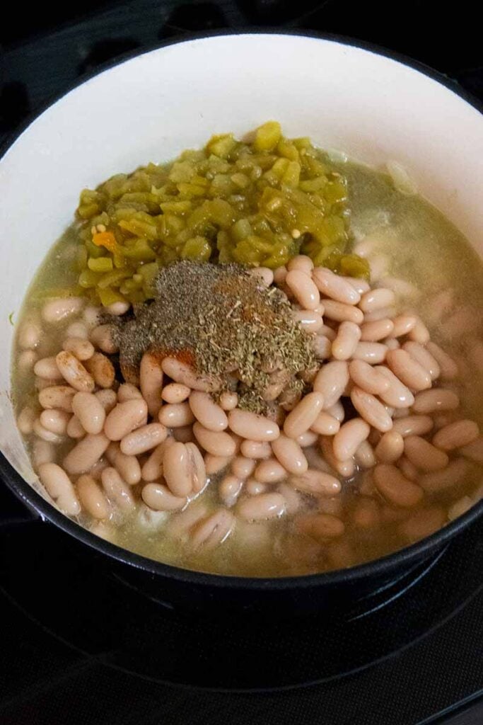 Ingredients for white chicken chili in a large dutch oven