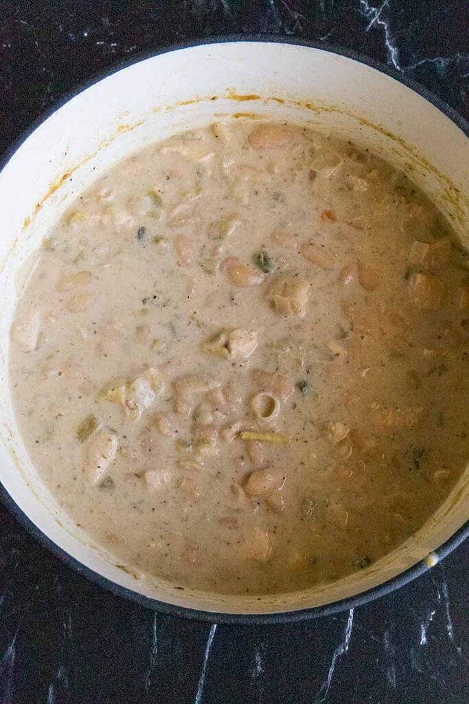 Cooked white chicken chili in a large dutch oven