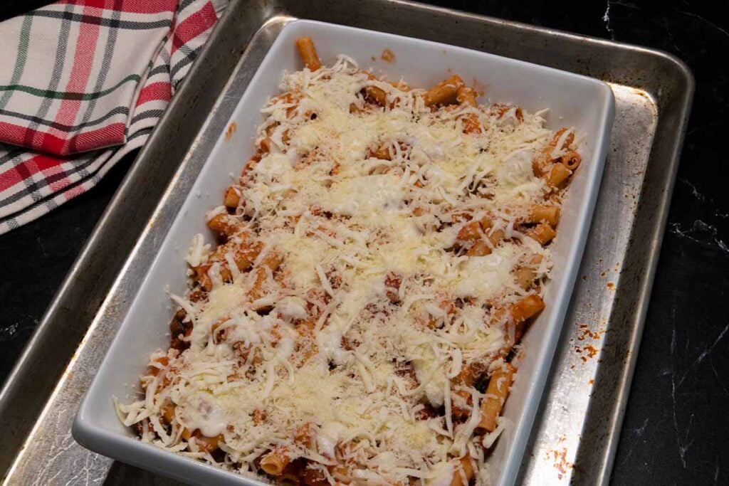 an assembled ziti casserole dish ready to go into the oven