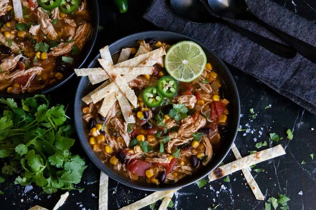 chicken tortilla soup with tortilla strips garnish