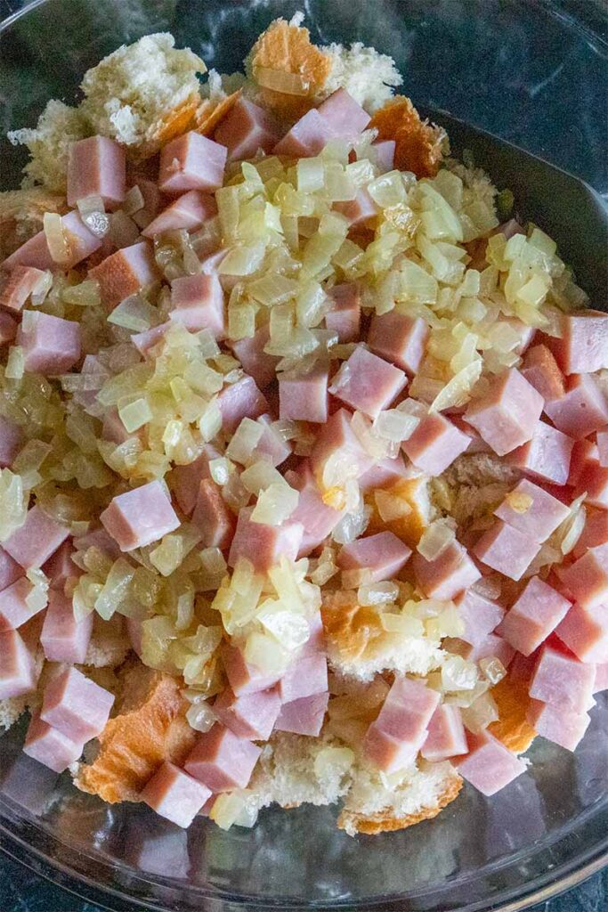 Strata mix in a glass mixing bowl.