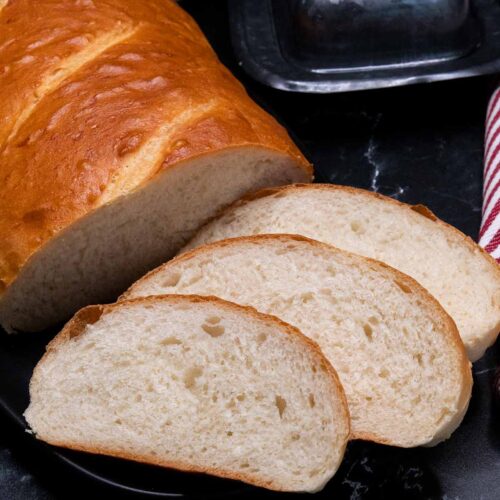 slices of Italian bread on black platter