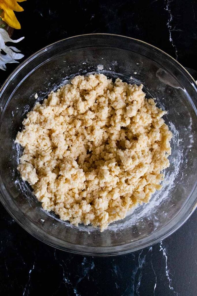 cookies dough in a glass mixing bowl