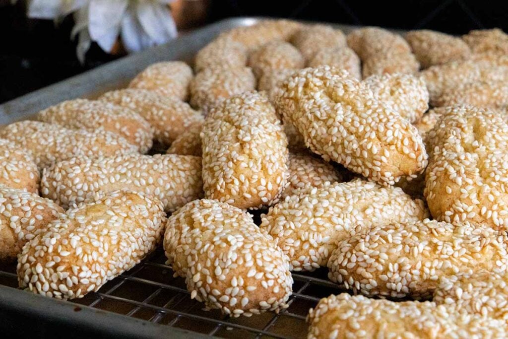 Italian sesame seed cookies on baking sheet.