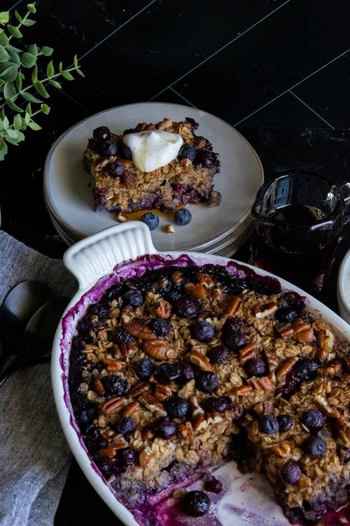 baked oatmeal in baking dish and on a gray plate