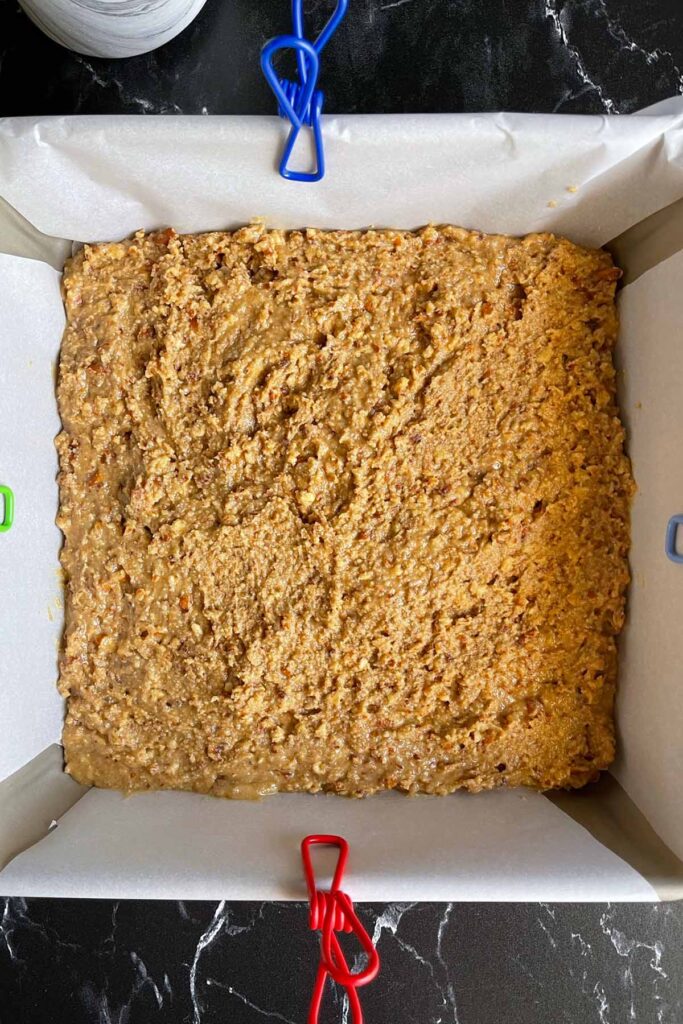 Peanut butter mixture in a 9x9 baking pan.