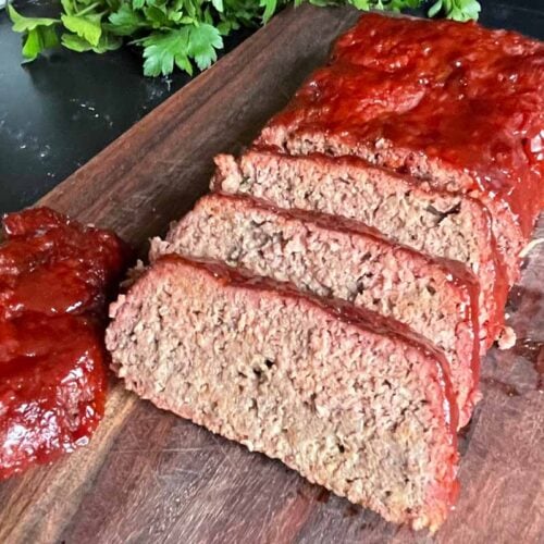 smoked meatloaf sliced on a cutting board