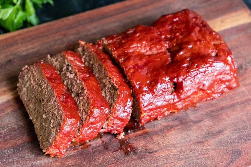 Smoked meatloaf on a cutting board.