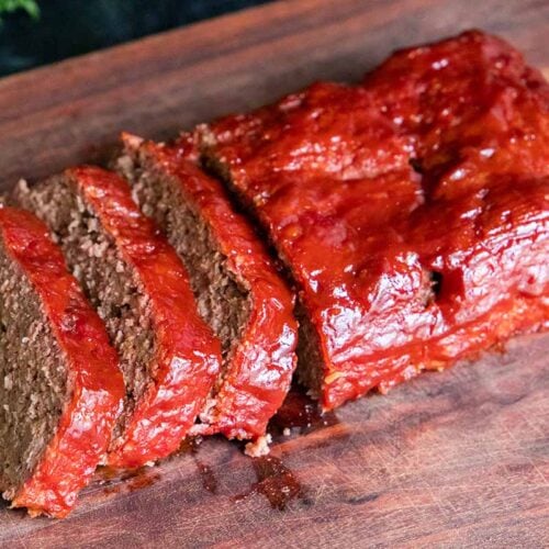 Smoked meatloaf on a cutting board.