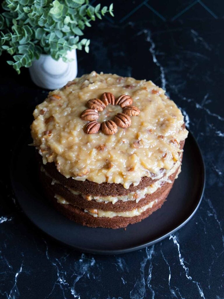 Original Baker's German Chocolate Cake on a black plate.