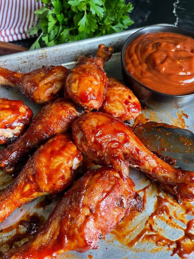 bbq chicken legs on a sheet pan.