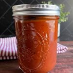 Homemade bourbon chipotle barbeque sauce in a mason jar.