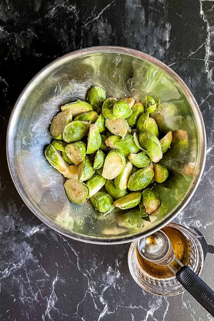 Raw brussels sprouts covered with bacon grease, salt and pepper.