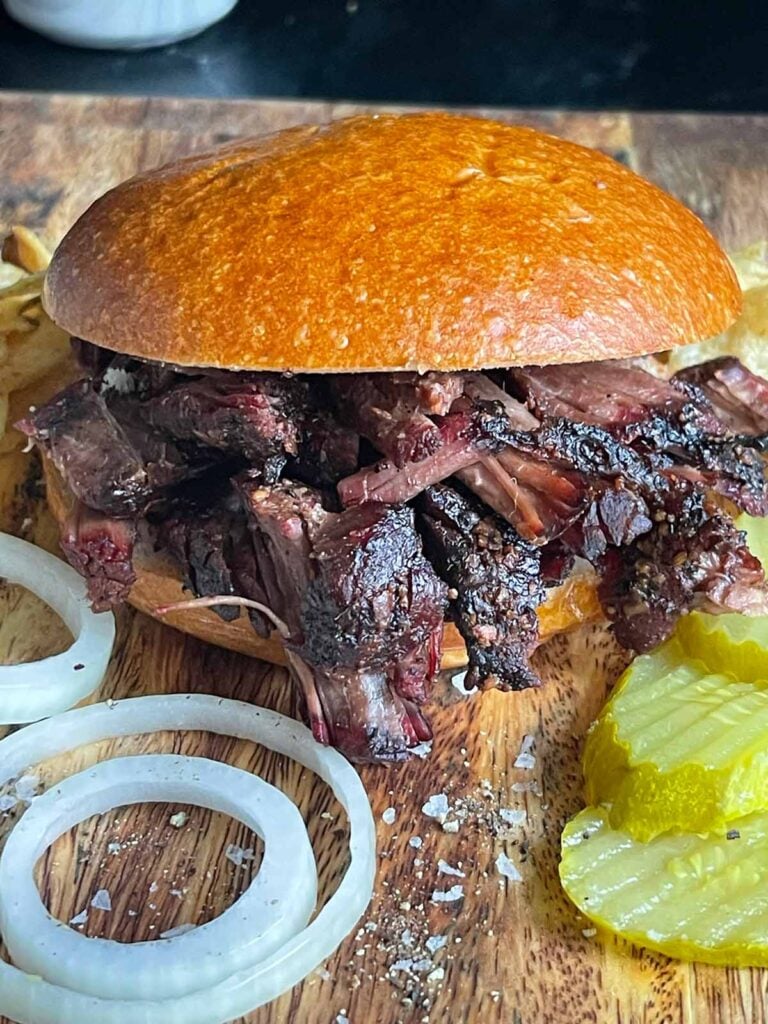 A pulled beef sandwich made from leftover smoked chuck roast.