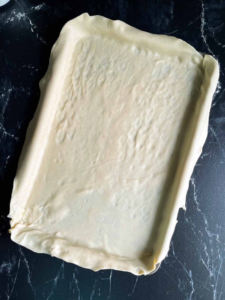 Pie crust filling the entire sheet pan.