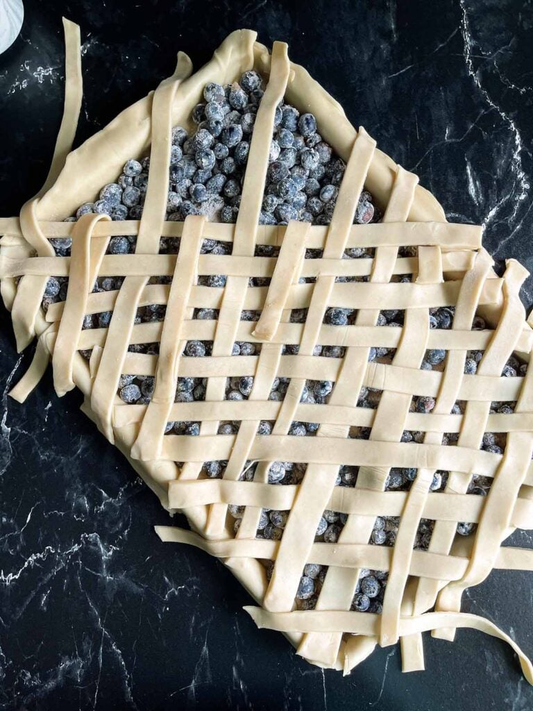 A lattice crust on a blueberry slab pie.
