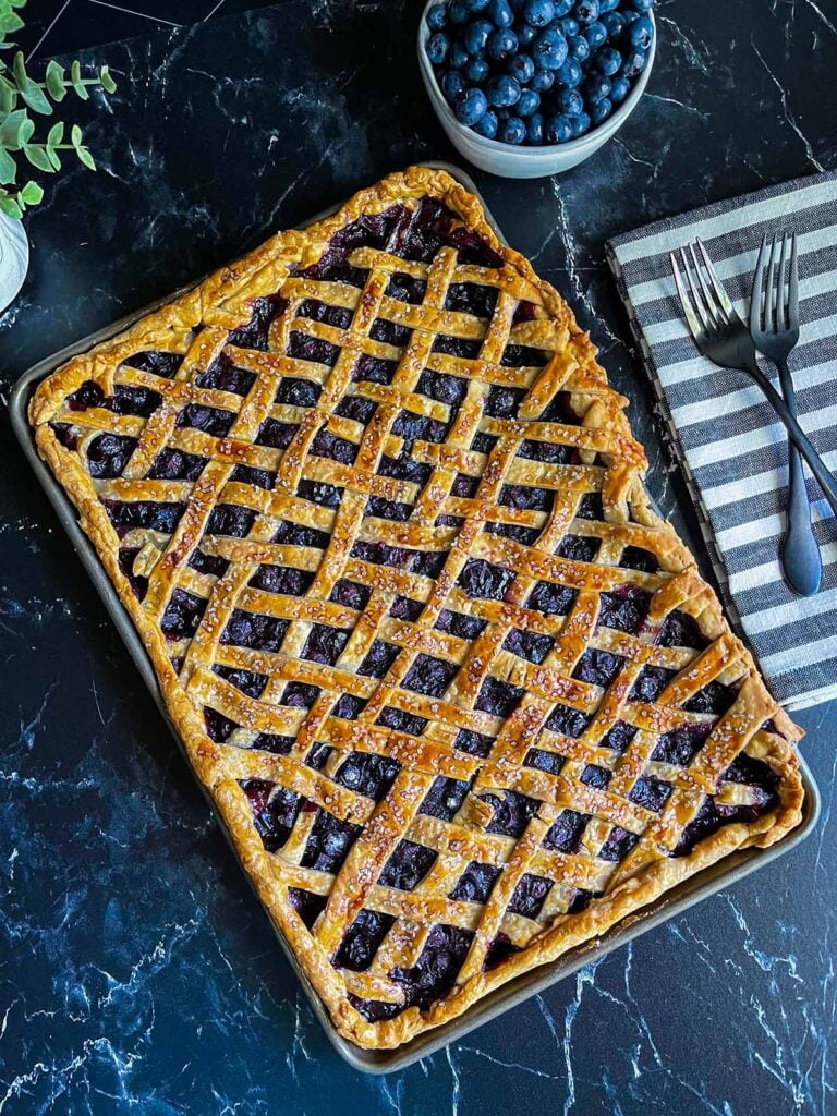 Blueberry slab pie baked in the sheet pan.