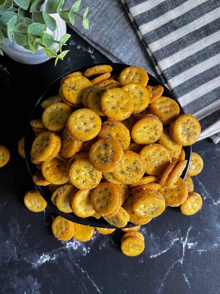 Cheesy Ranch Ritz Bits Crackers in a black bowl.
