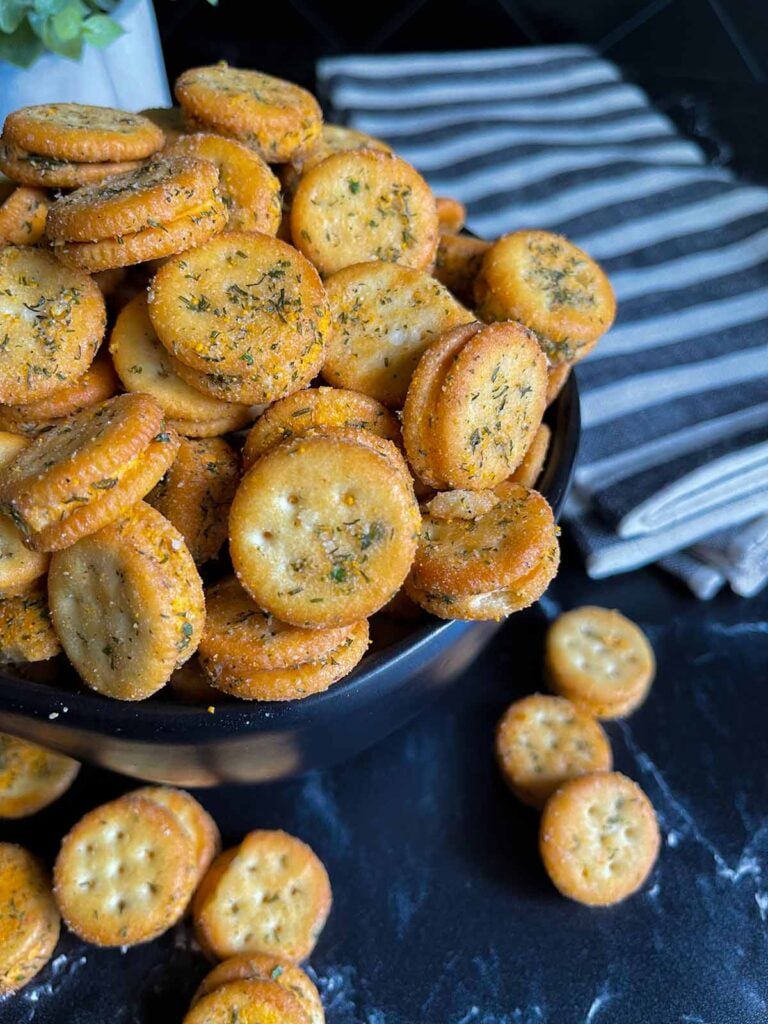 Cheesy Ranch Ritz Bits Crackers in a black bowl.