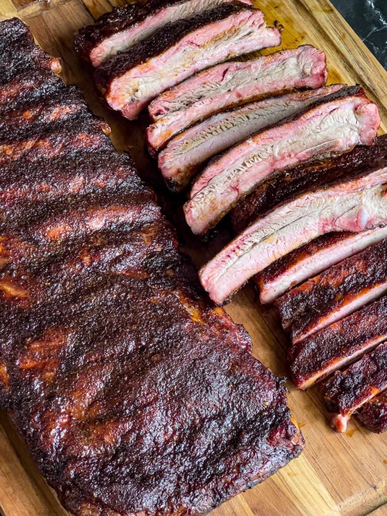 Two racks of ribs on a cutting board