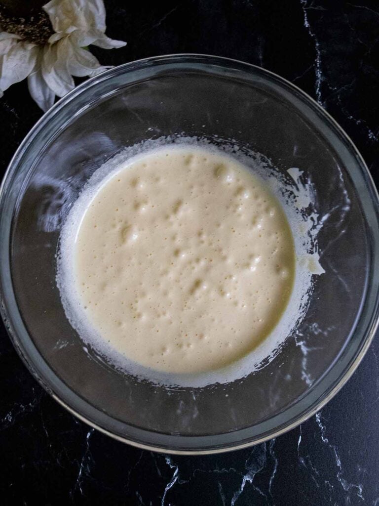 Cake batter in a glass mixing bowl..