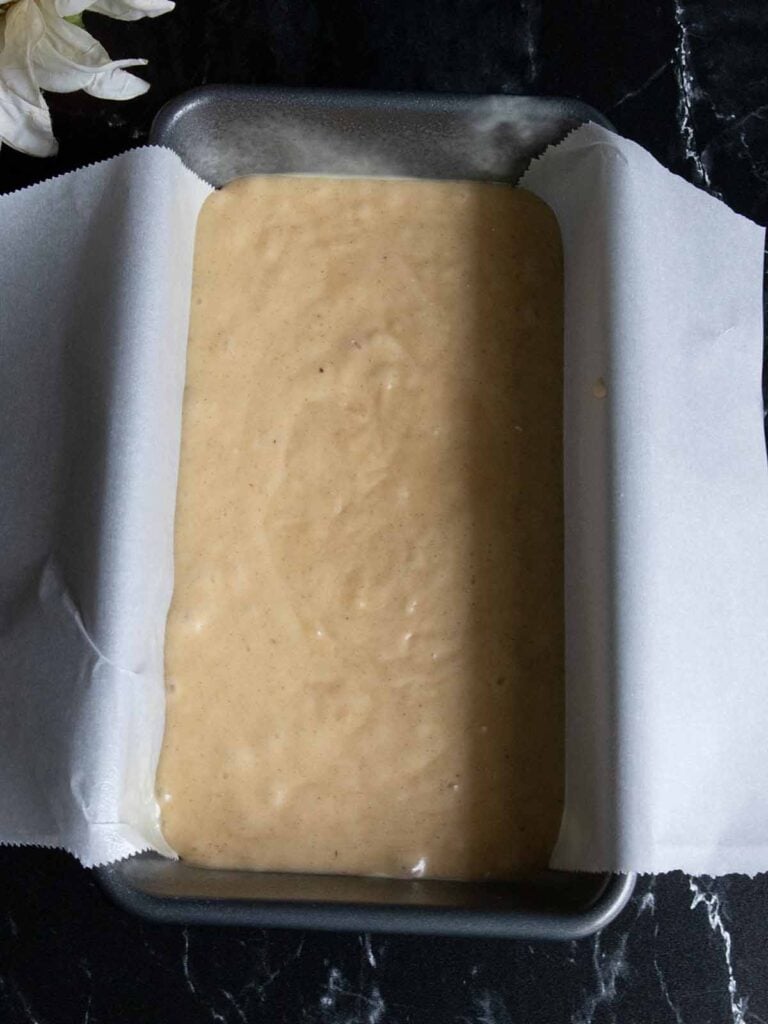 Cake batter in a loaf pan.