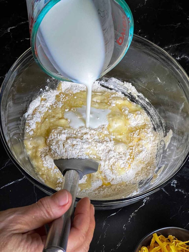 Buttermilk being stirred into the dry ingredients.