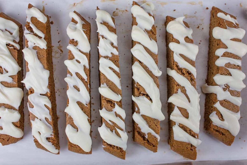 Gingerbread biscotti on a baking sheet.