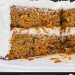 Whole carrot cake with pieces removed to show the inside of the cake.