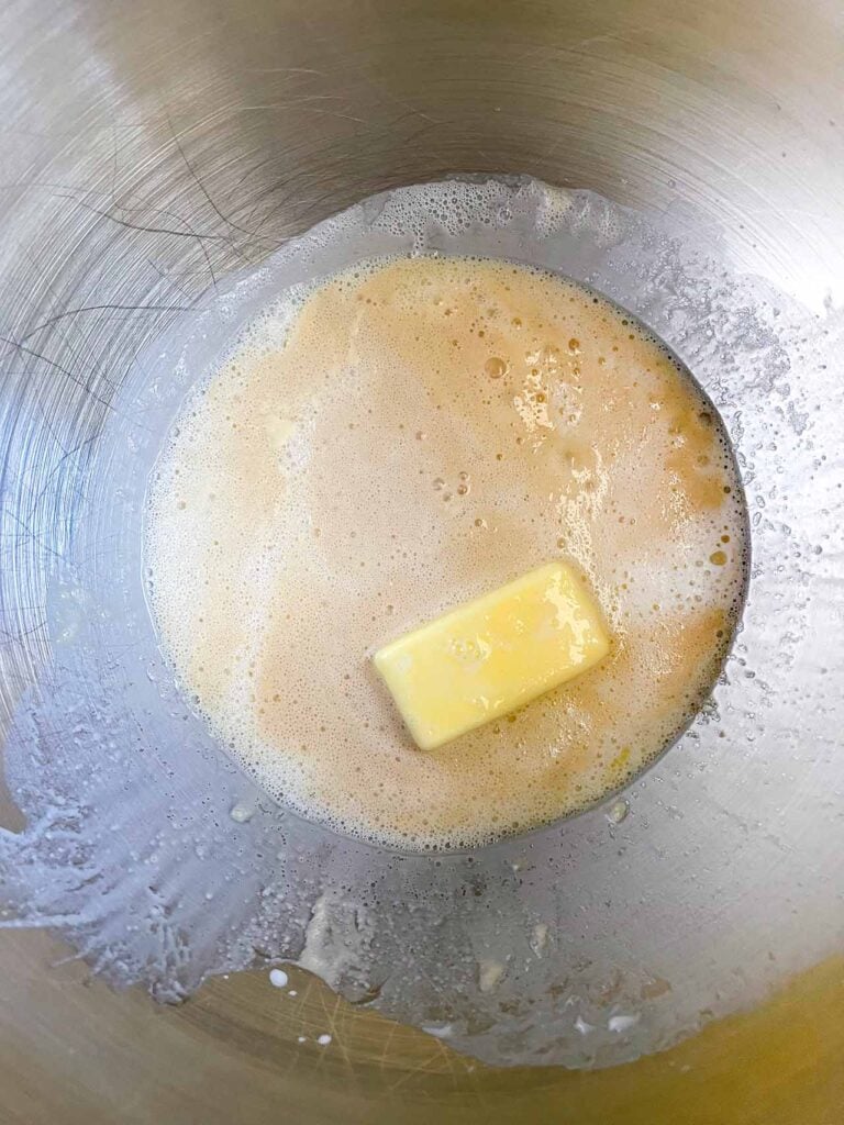 Liquid ingredients for crescent roll dough in a metal bowl.