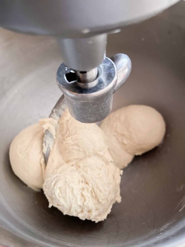 Crescent roll dough in a metal bowl.