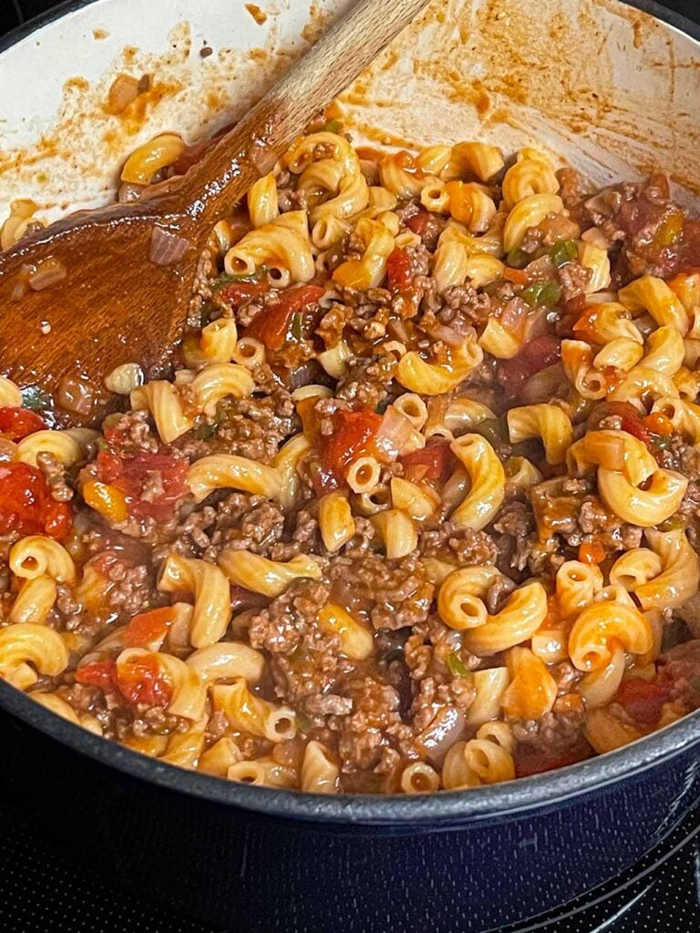 Old fashioned goulash (american goulash) in a large blue dutch oven.