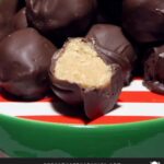 Peanut butter balls stacked on a red and green plate.