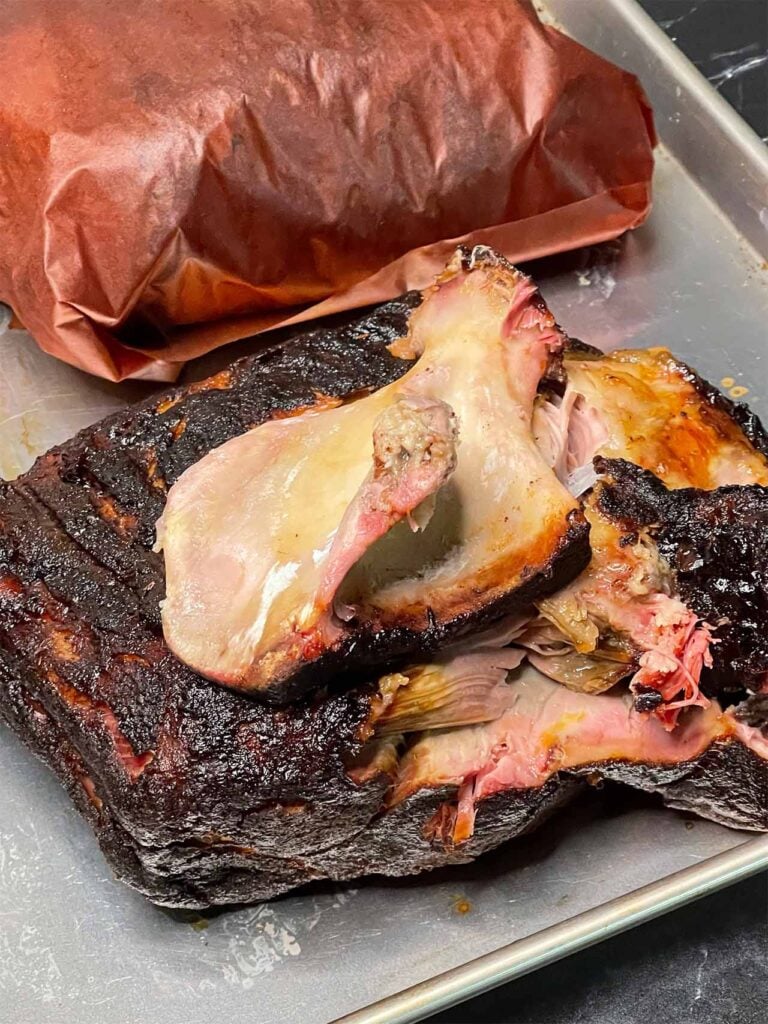 Smoked Pork Shoulder - This recipe and method produces a juicy, tender, perfectly smoked pork butt/shoulder EVERY TIME! The pork butt shoulder bone pulled out clean from the meat.