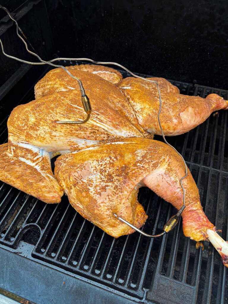 A spatchcocked turkey on a masterbuilt electric grill.