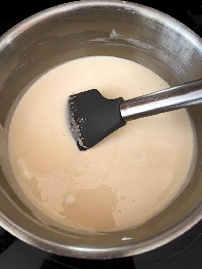 Dark chocolate fudge ingredients in a metal saucepan.