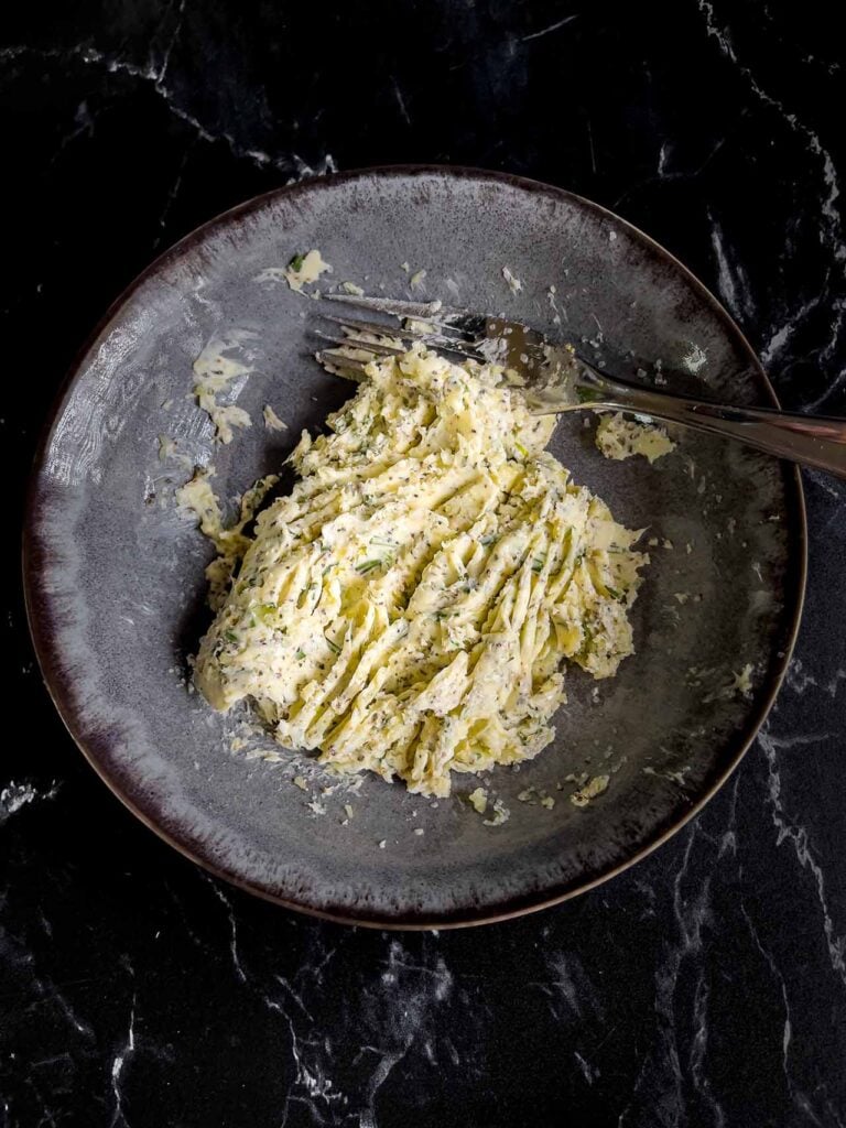 Softened butter mixed with herbs and seasonings.