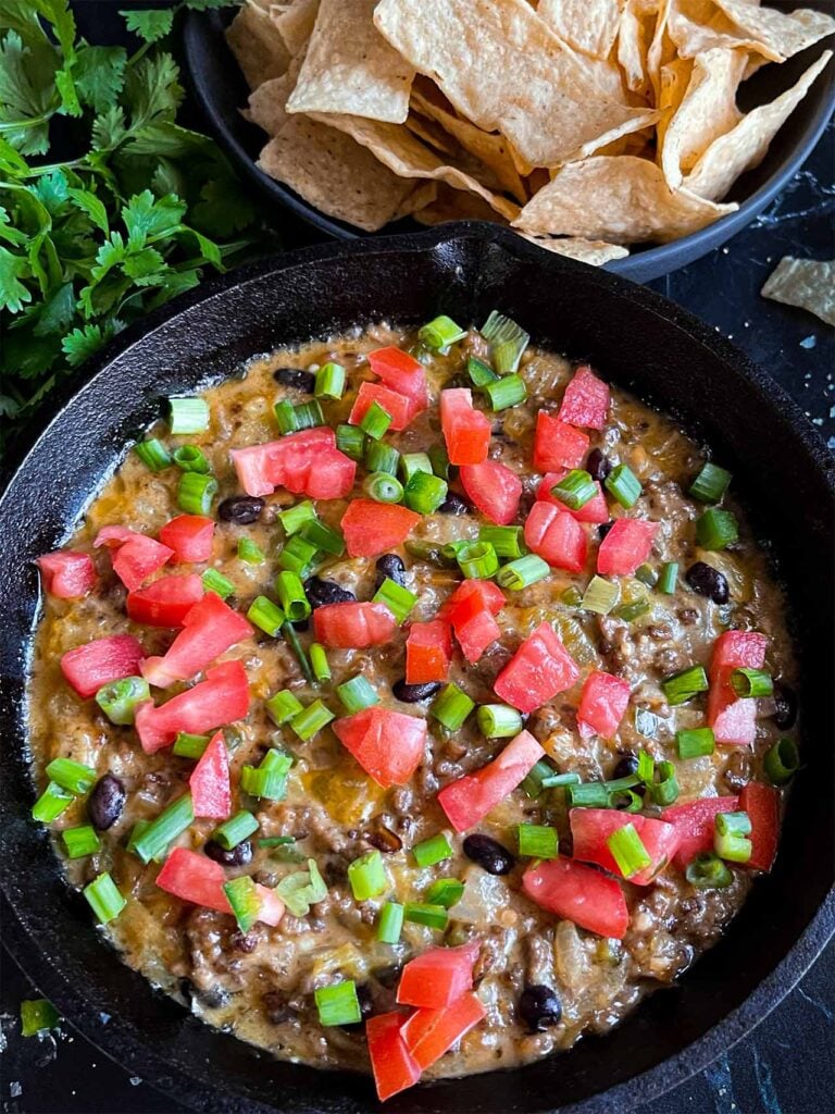 Queso fundido in a cast iron skillet.