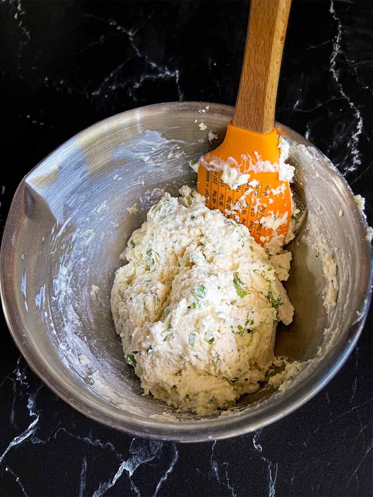 Dumpling dough in a stainless steel bowl.