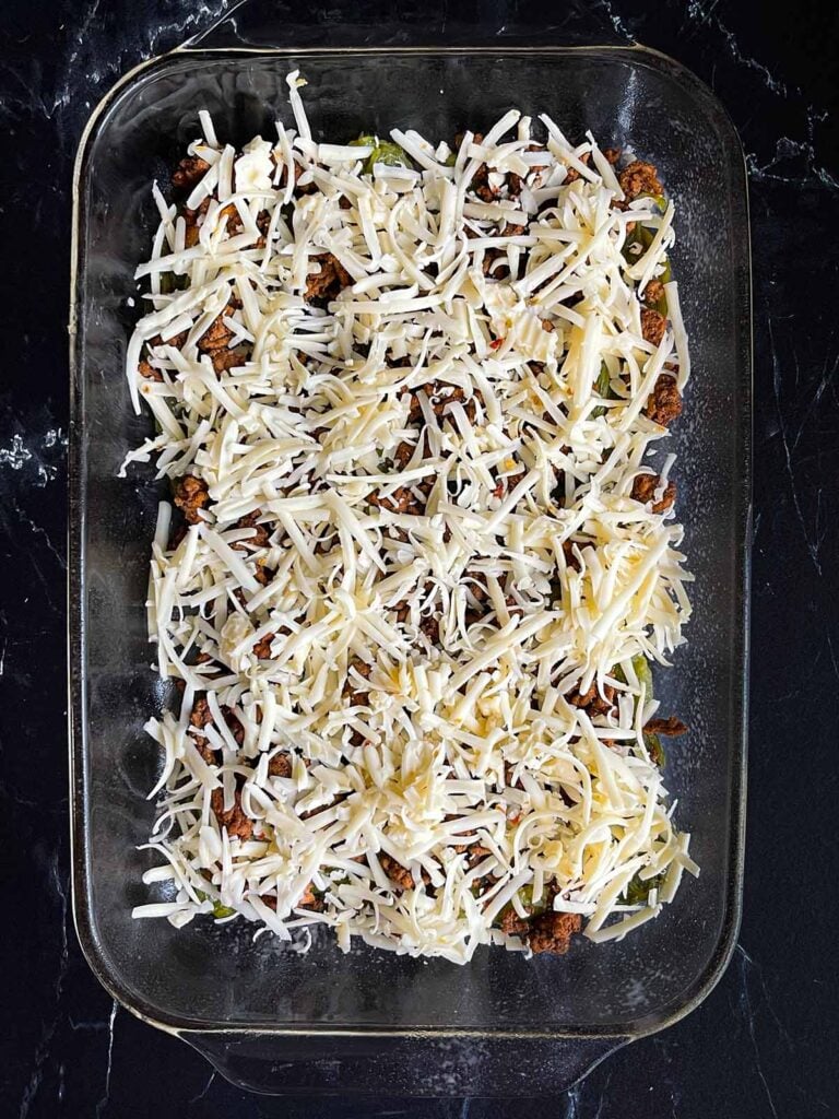 One layer of chile relleno casserole in glass baking dish.