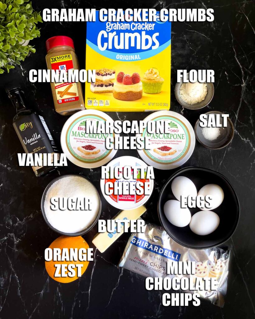 Cannoli cheesecake ingredients on a dark background.