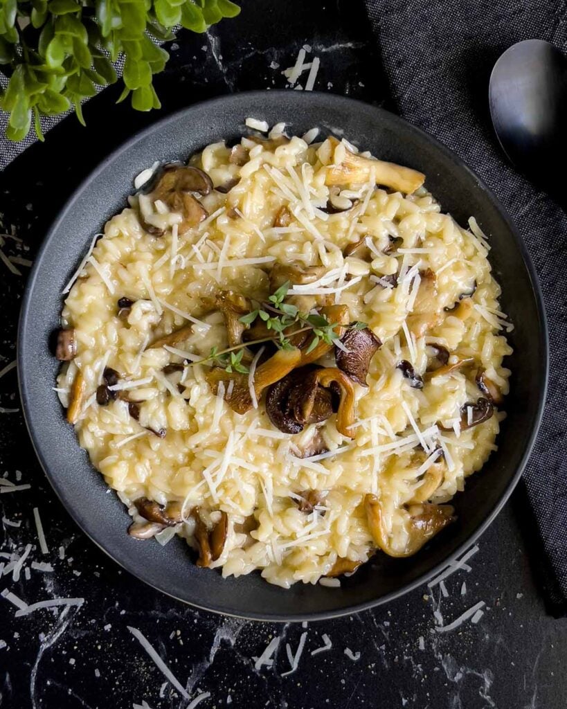 Mushroom Risotto in a dark bowl.