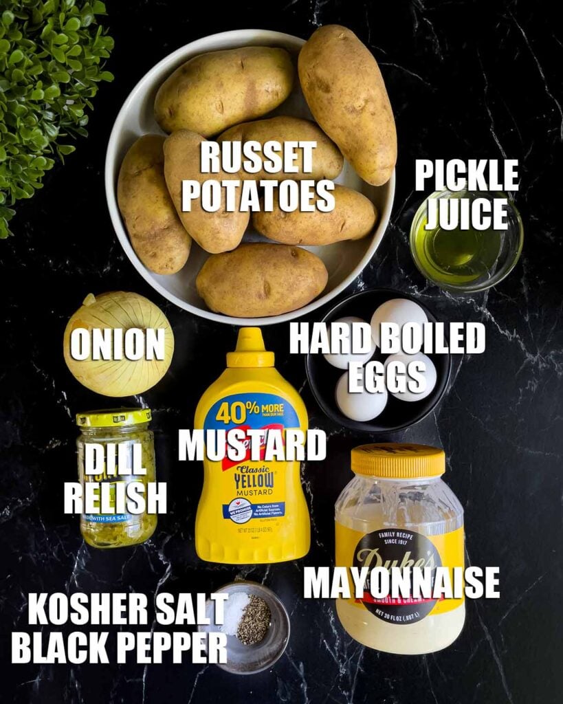 Southern potato salad ingredients on a dark surface.