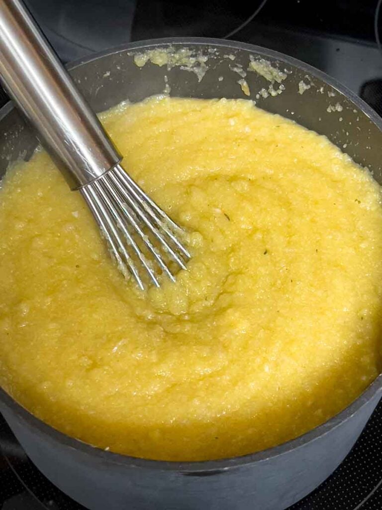 Polenta cooking on the stovetop.